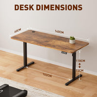 Electric Standing Desk 140x60cm (55.1"x23.6"), Height Adjustable Sit Stand Desk with Hooks, Metal Frame Stand up Desk with Powerful Motor, Ergonomic Computer Desk for Home Office (Brown)